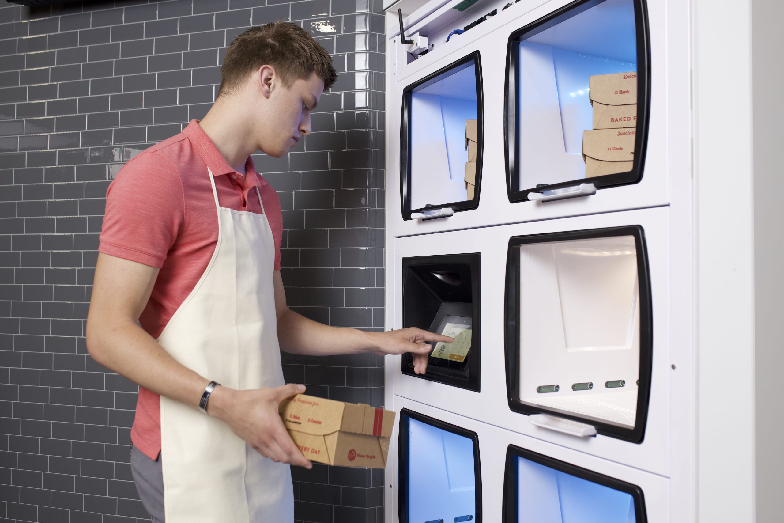 Restaurant employee loads order into Flow-Thru