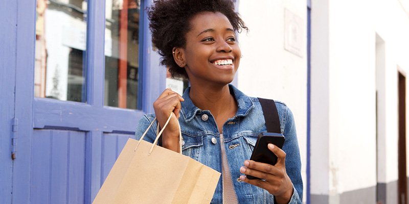 girl picking up food with a phone