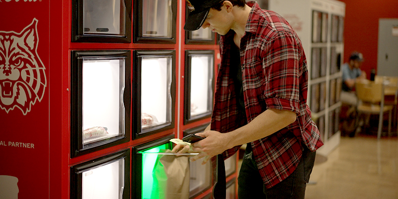 University of Arizona student picking up an Grubhub campus order