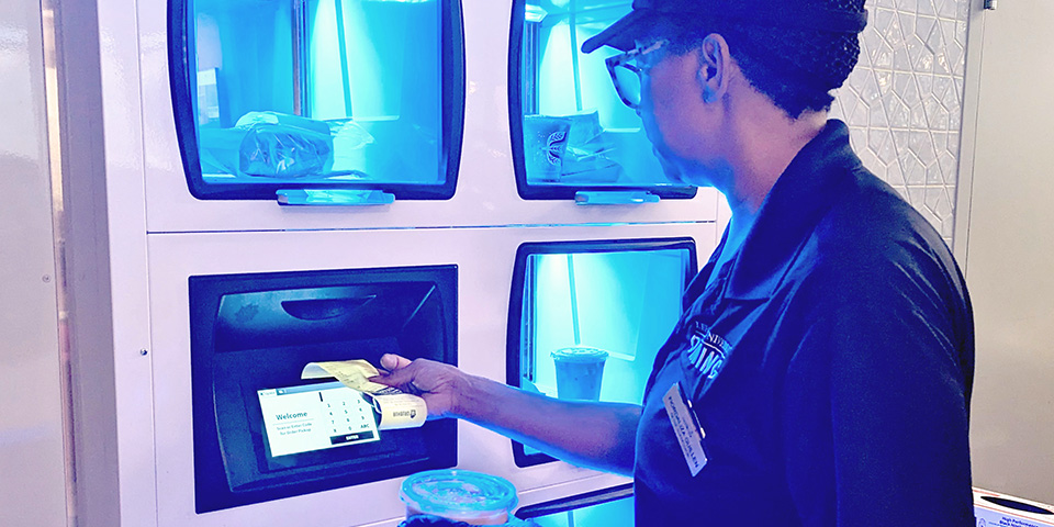 foodservice employee loading food locker