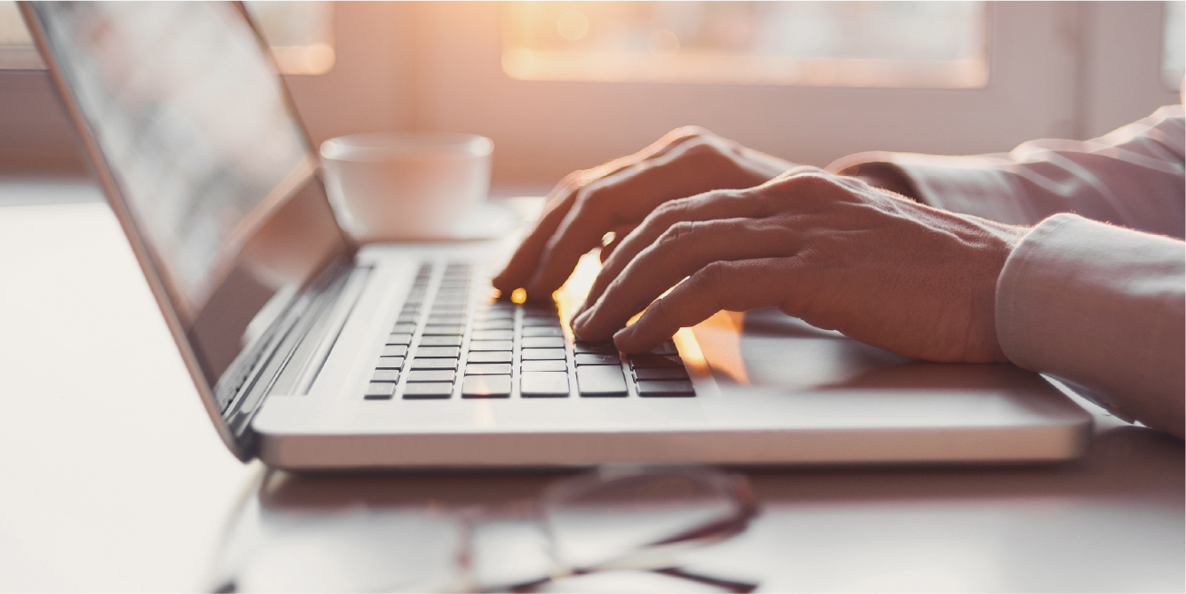 Person typing on computer