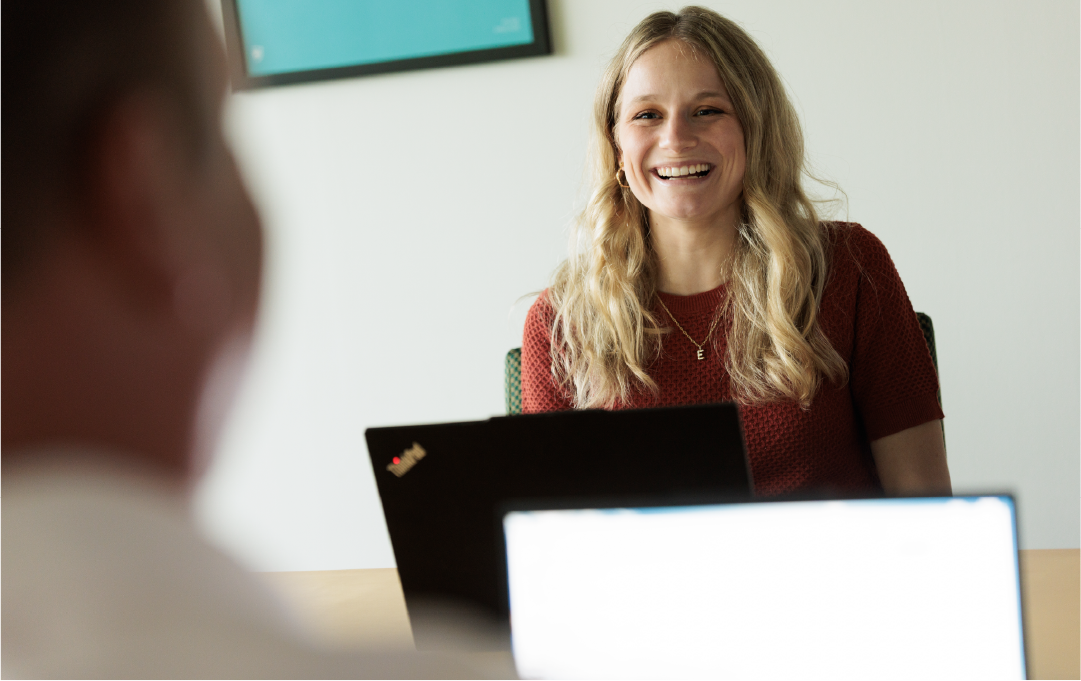 Apex employee smiling in meeting